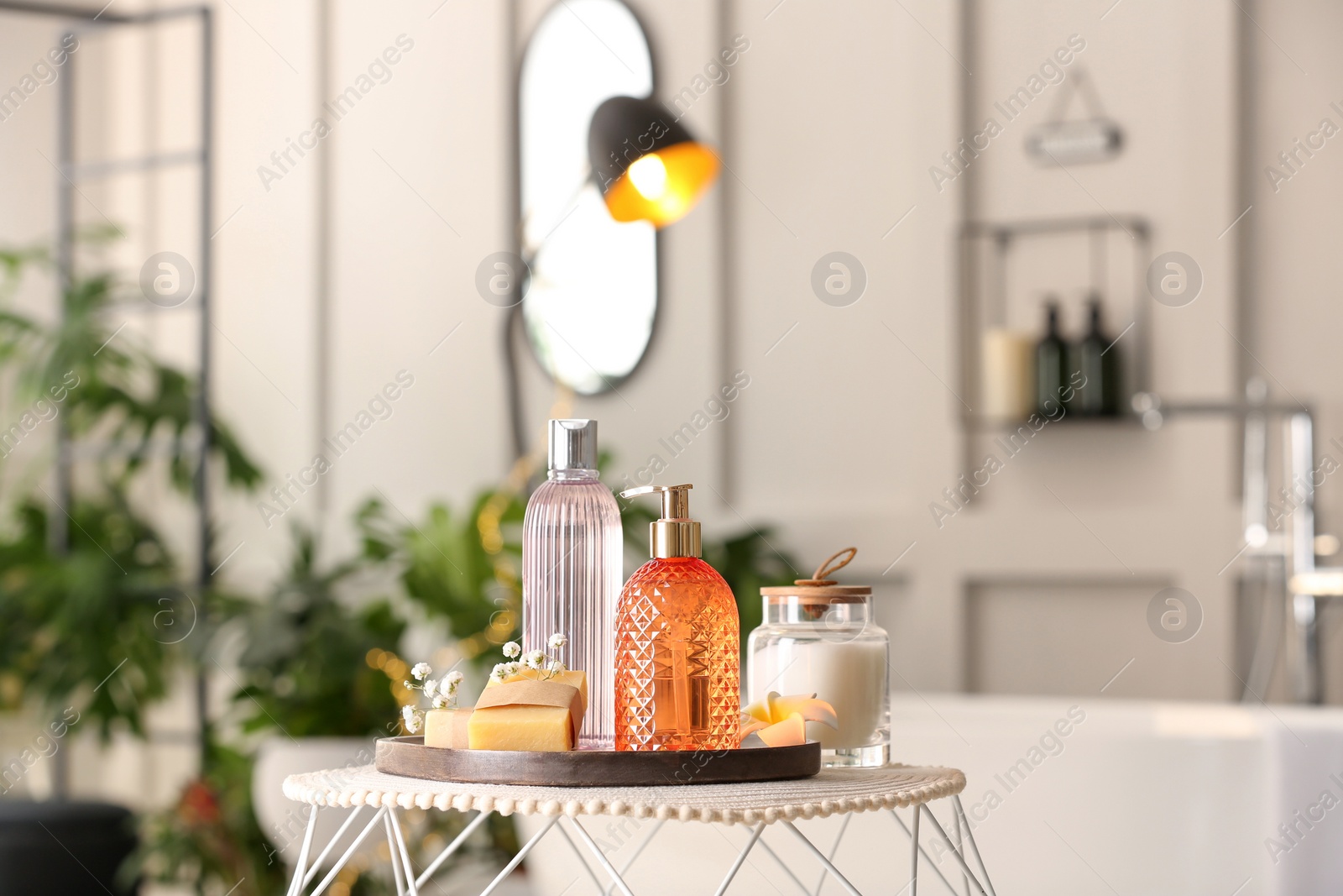 Photo of Liquid soap and other toiletries on table indoors