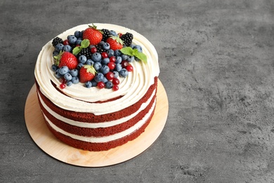 Photo of Delicious homemade red velvet cake and space for text on table