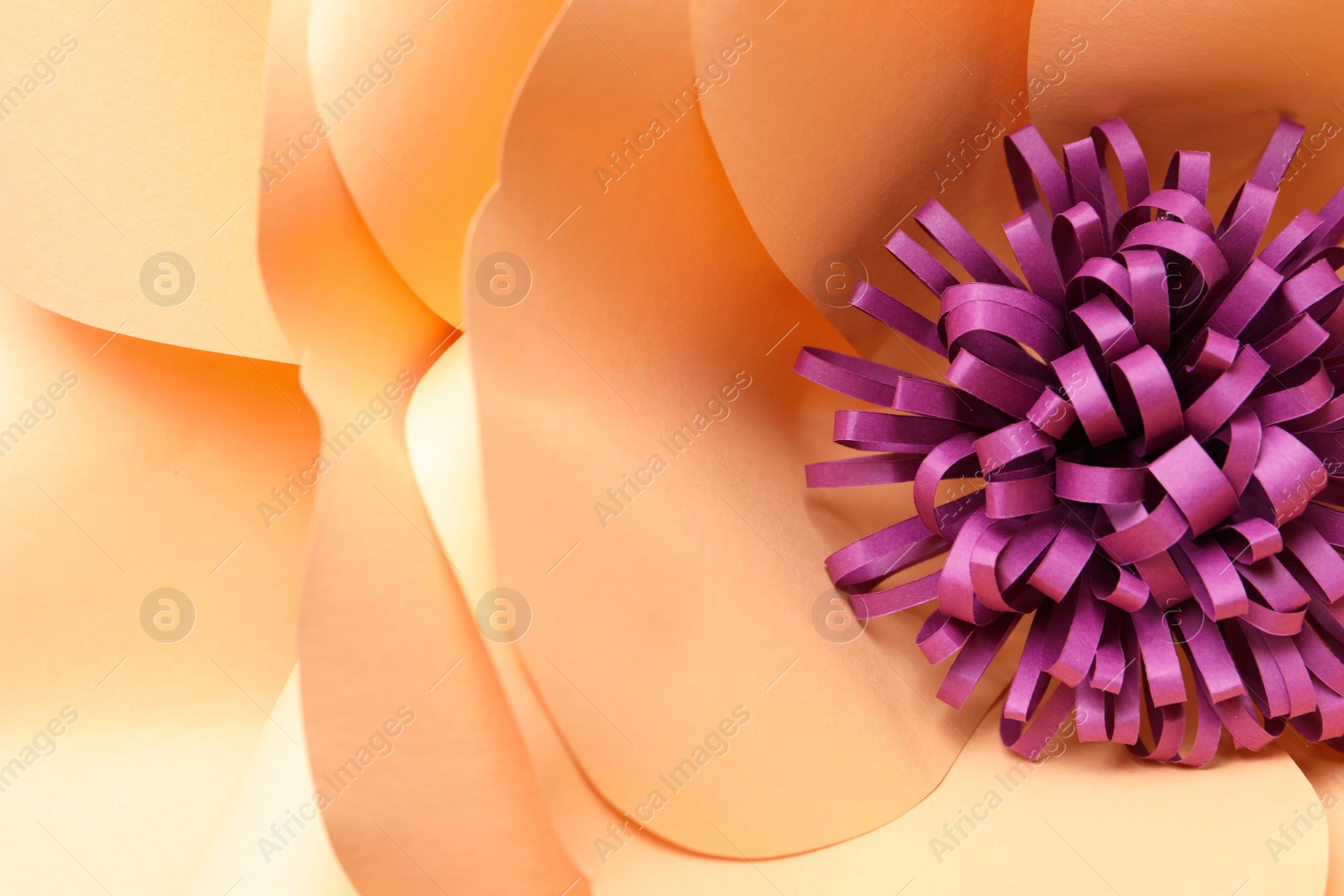 Photo of Beautiful yellow flower made of paper as background, top view