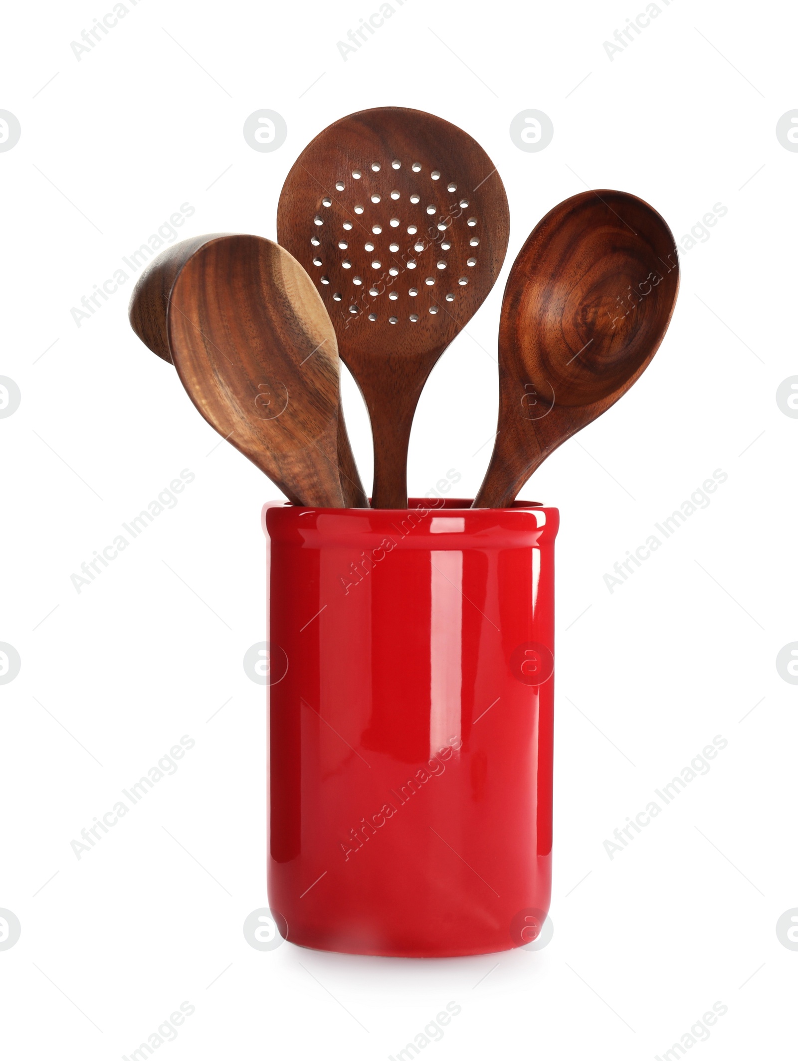 Photo of Set of wooden kitchen utensils in red holder isolated on white