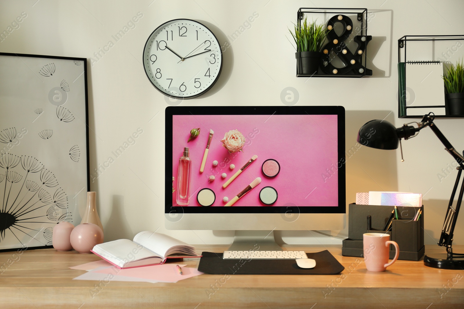 Photo of Modern workplace interior with computer on table