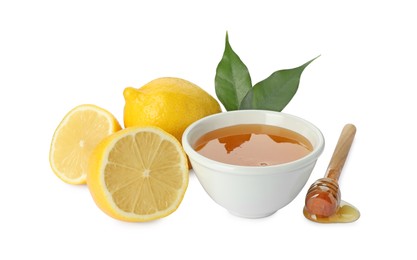 Photo of Ripe lemons, leaves, bowl of honey and dipper isolated on white