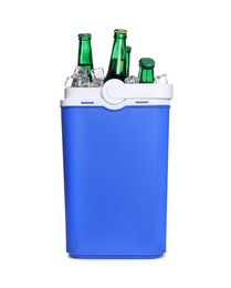 Photo of Blue plastic cool box with bottles isolated on white