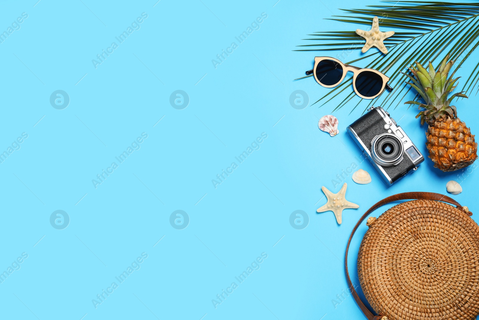 Photo of Flat lay composition with beach accessories on color background, space for text