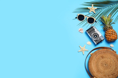 Photo of Flat lay composition with beach accessories on color background, space for text