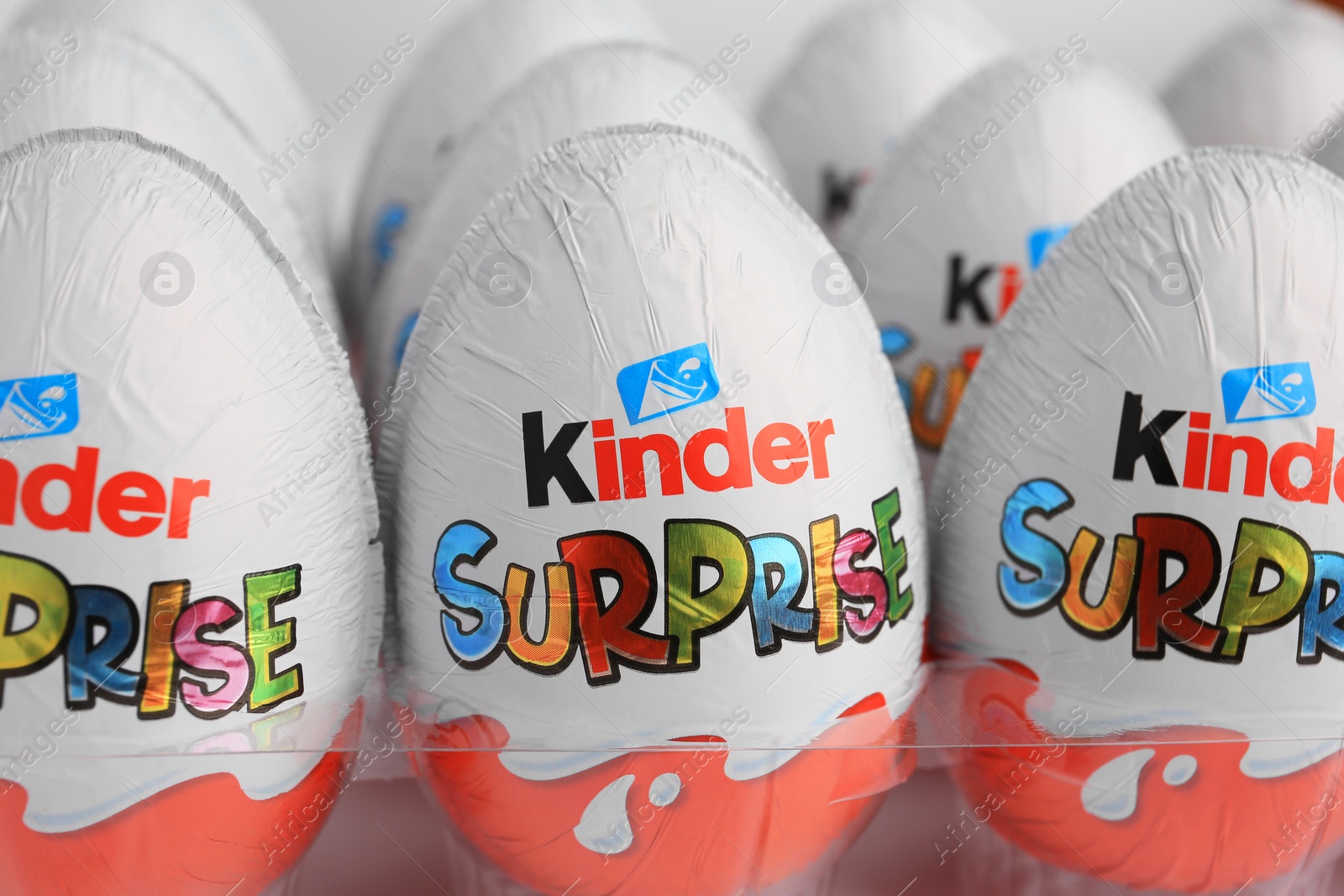 Photo of Sveti Vlas, Bulgaria - June 26, 2023: Kinder Surprise Eggs in plastic tray on white background, closeup