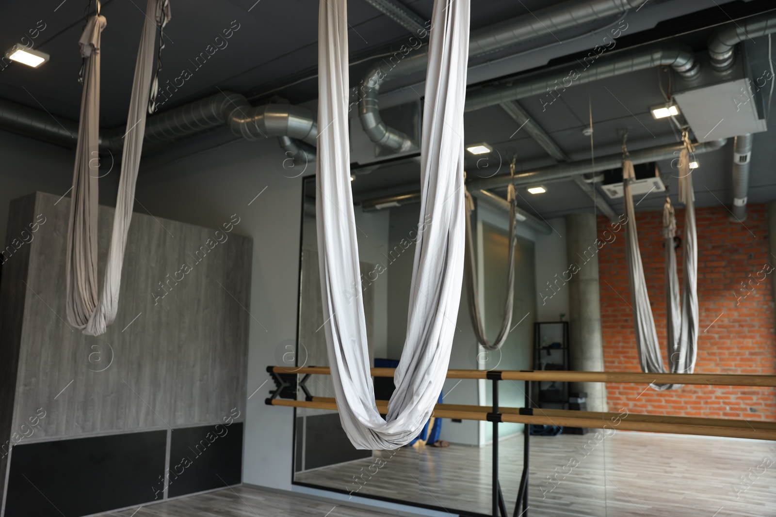 Photo of Many hammocks for fly yoga in studio