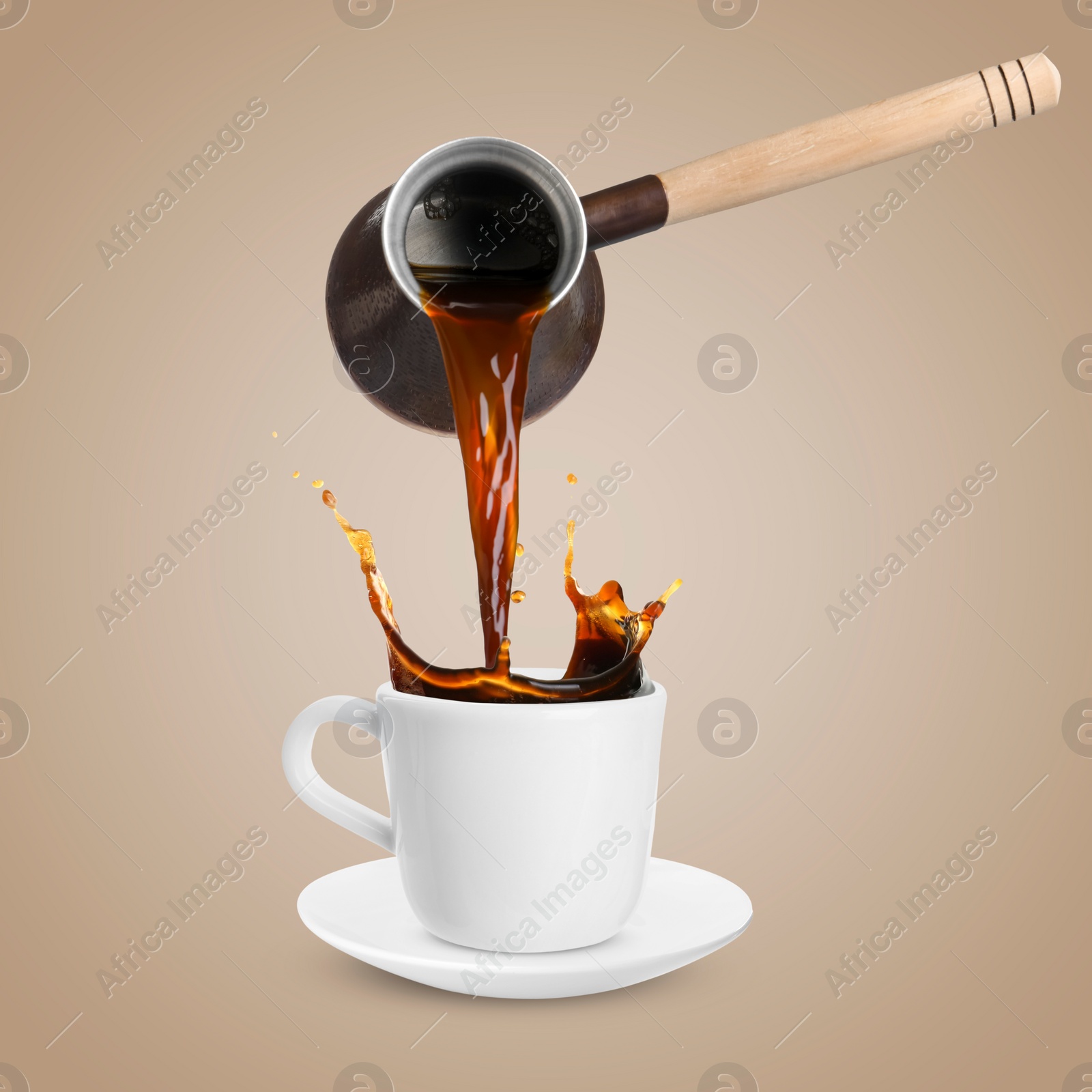 Image of Pouring freshly brewed aromatic coffee from turkish pot into cup. Objects in air on dark beige background