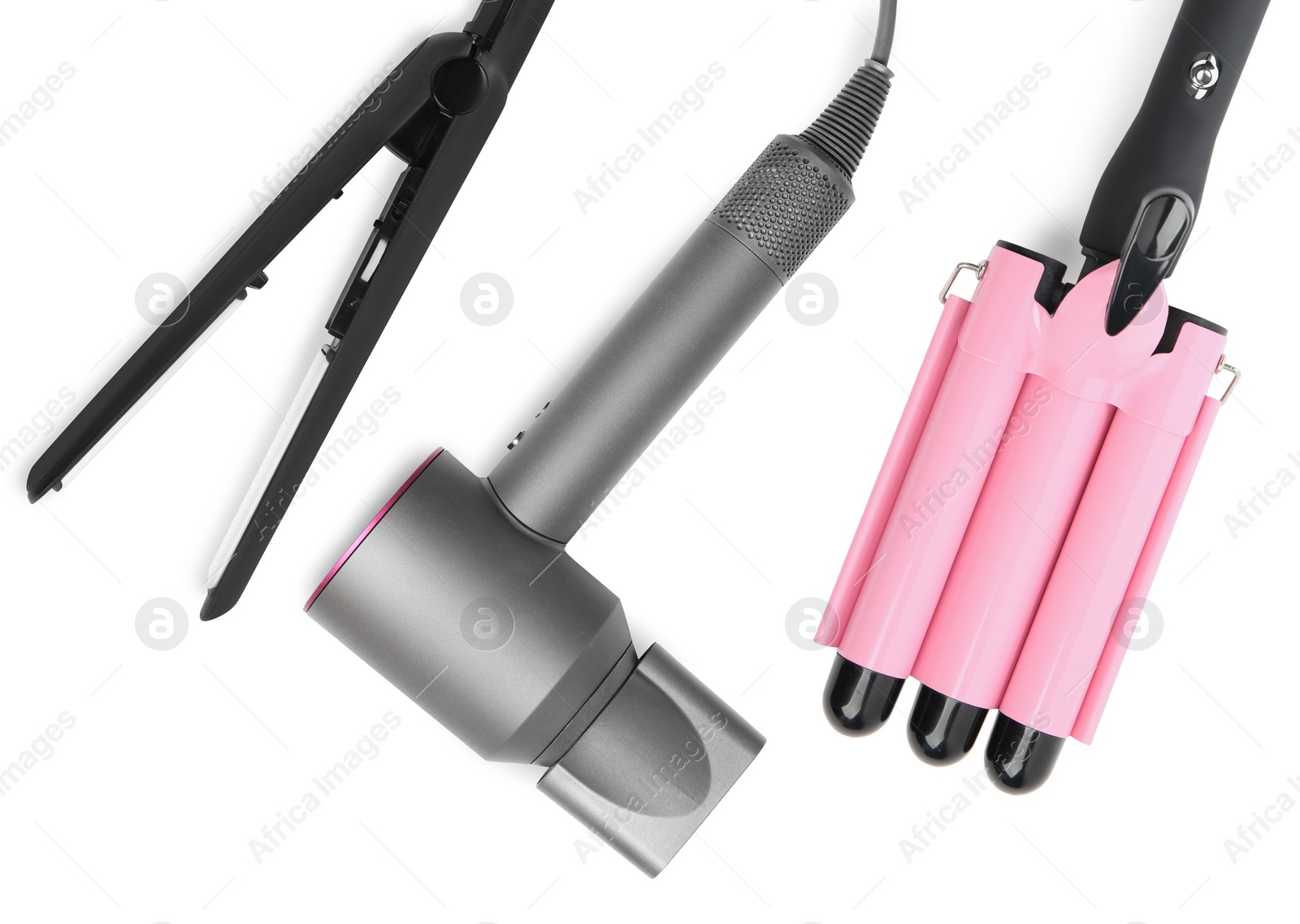 Image of Hair dryer, straightener and triple curling iron on white background, top view