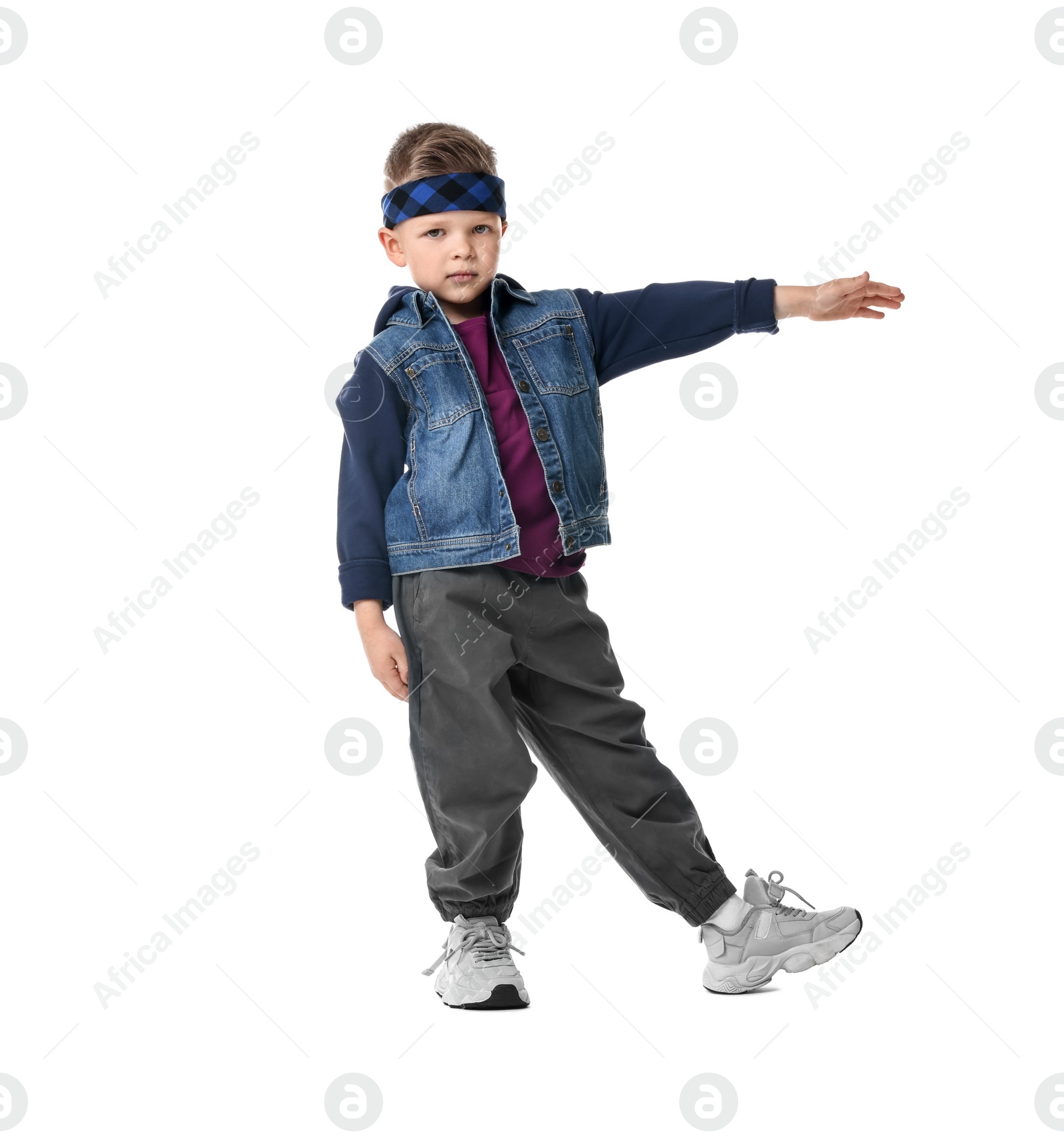 Photo of Happy little boy dancing on white background