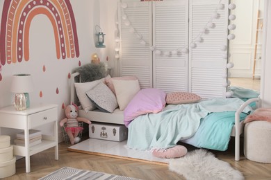 Photo of Modern girl's bedroom interior with stylish furniture. Idea for design