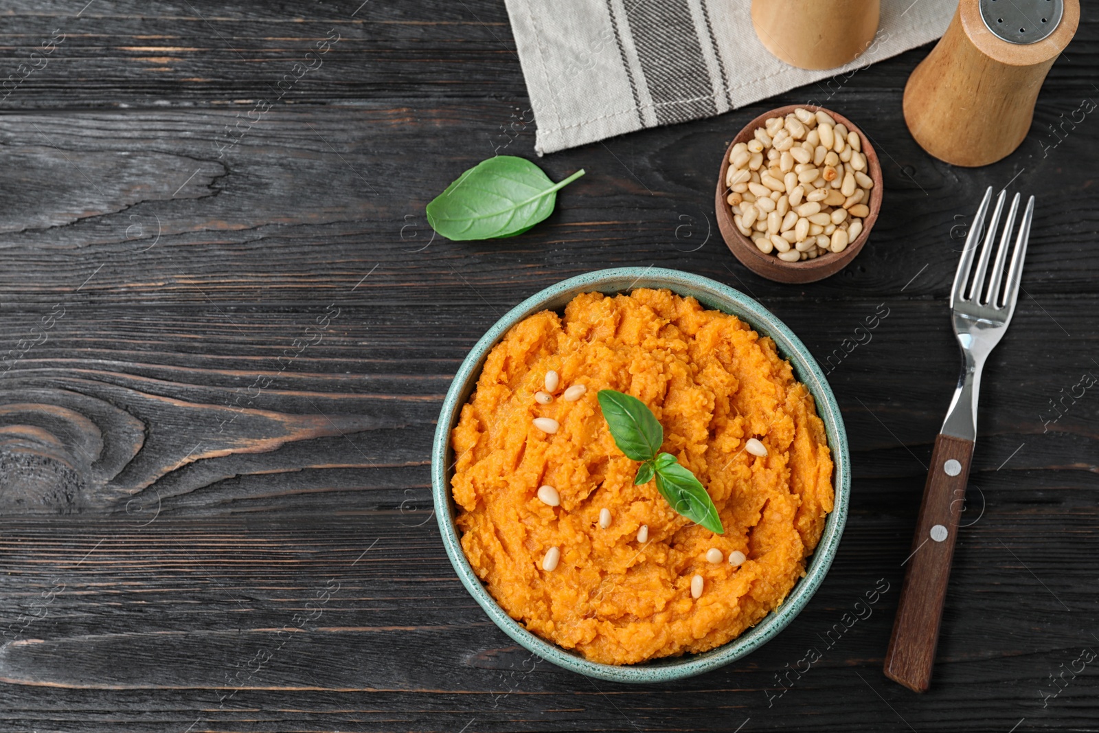 Photo of Flat lay composition with mashed sweet potatoes on wooden background, space for text