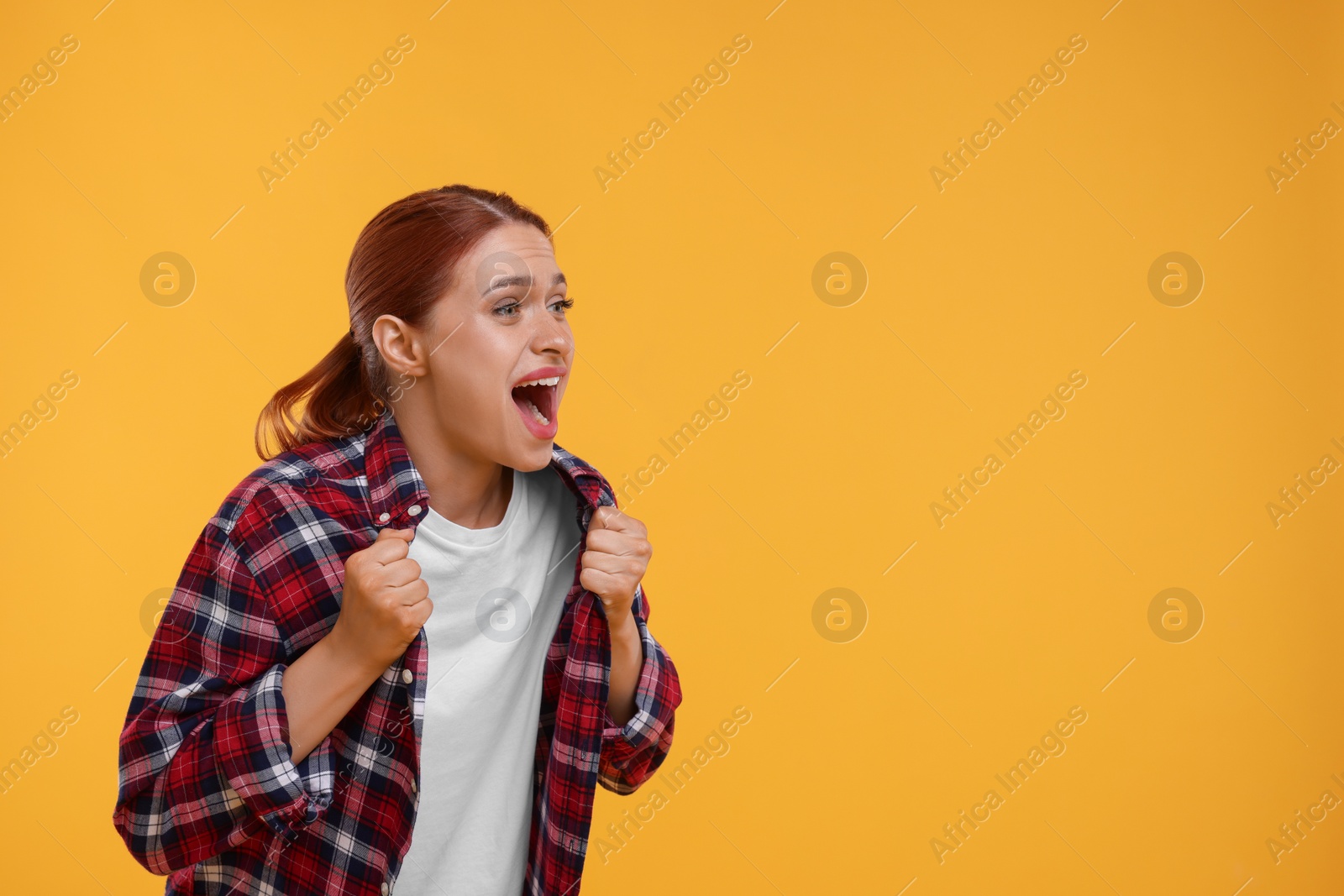 Photo of Emotional fan on yellow background, space for text