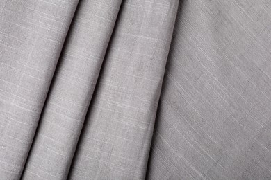 Grey hemp cloth as background, top view. Natural fabric