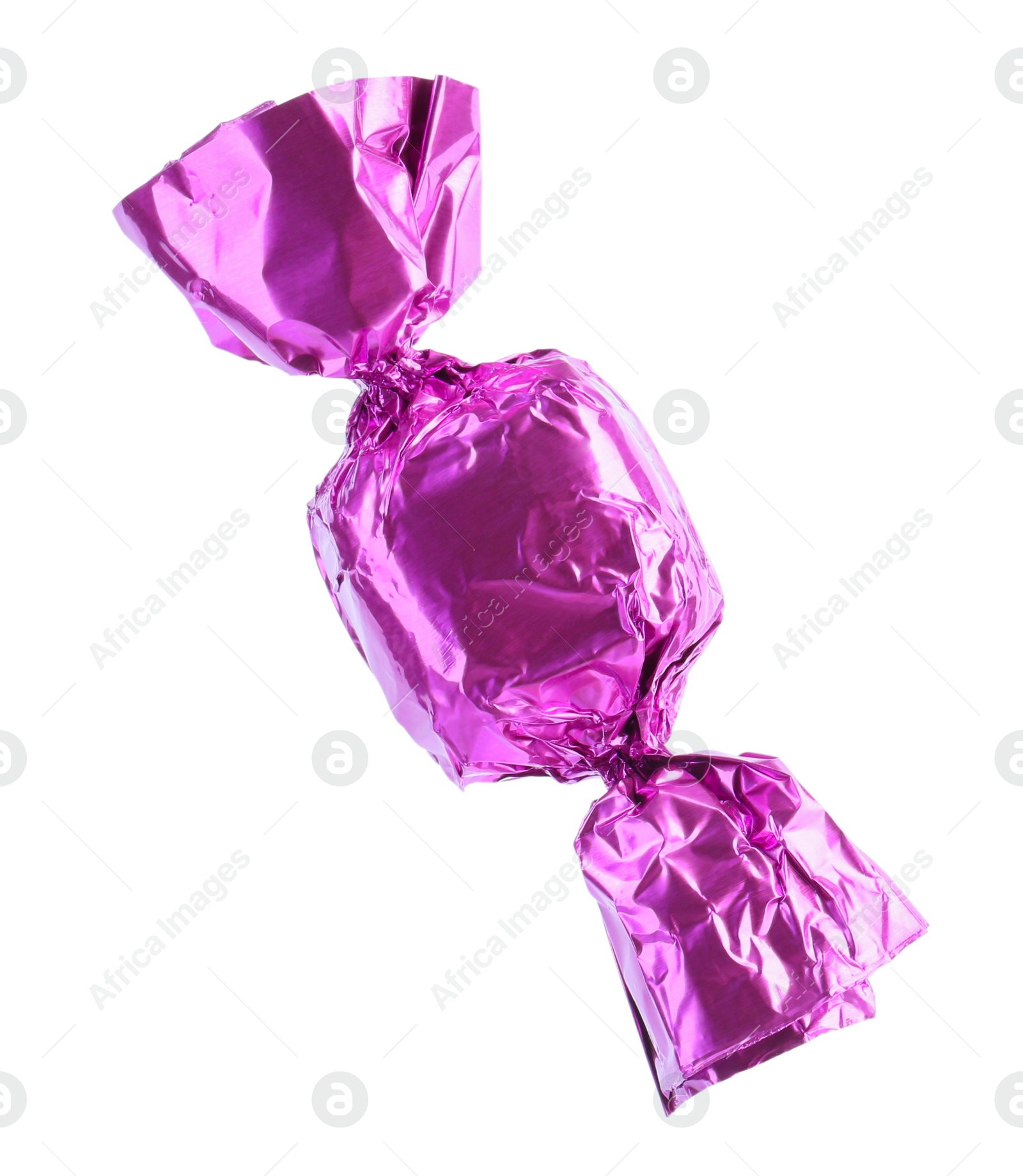 Photo of Tasty candy in violet wrapper isolated on white
