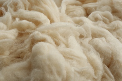 Photo of Soft white wool texture as background, closeup