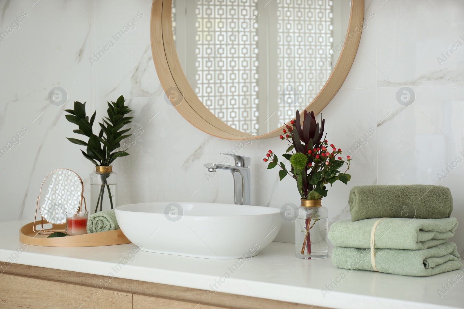 Photo of Modern bathroom interior with stylish mirror and vessel sink