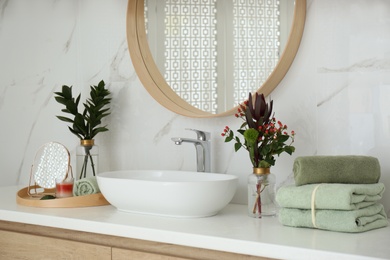 Photo of Modern bathroom interior with stylish mirror and vessel sink