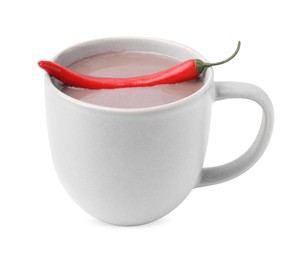 Photo of Cup of hot chocolate with chili pepper on white background