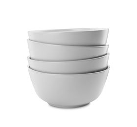 Clean empty ceramic bowls on white background