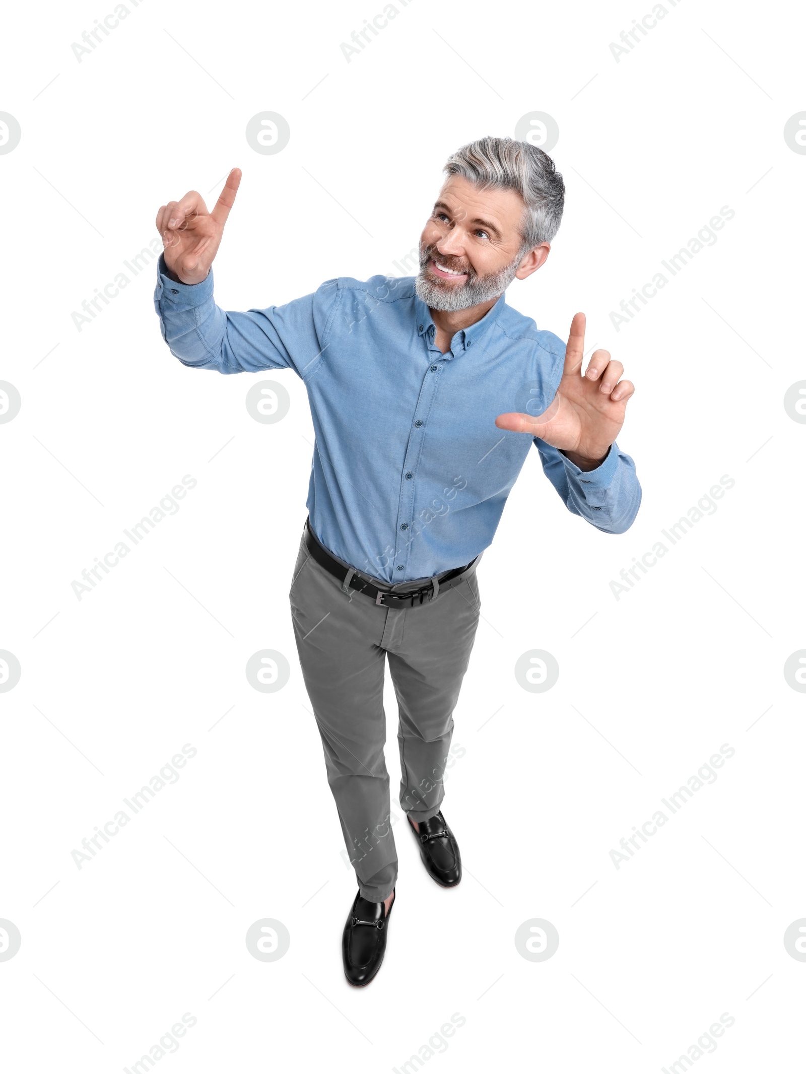 Photo of Mature businessman in stylish clothes posing on white background, above view