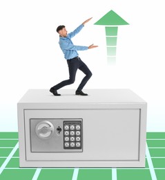 Image of Multiplying wealth, increasing savings. Excited man pointing at green arrow up while standing on big steel safe against white background