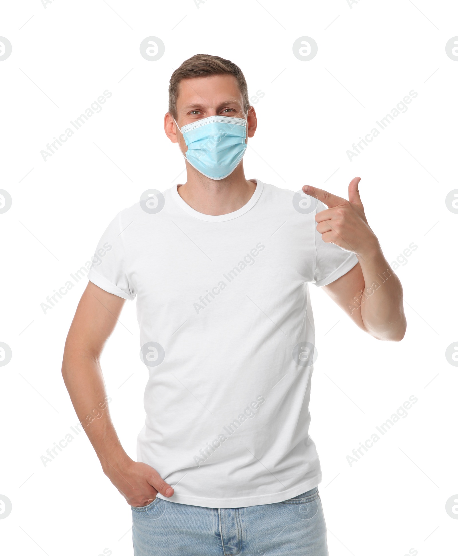 Photo of Male volunteer in mask on white background. Protective measures during coronavirus quarantine