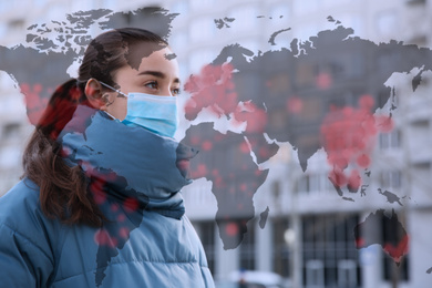 Image of Woman wearing medical mask outdoors during coronavirus outbreak