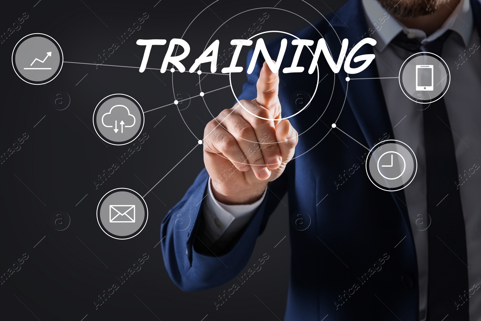 Image of Businessman touching virtual screen with inscription TRAINING on dark background, closeup 