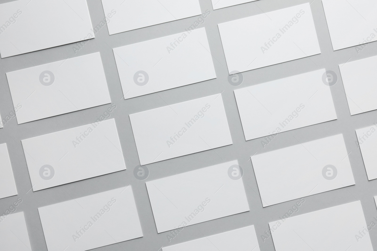 Photo of Blank business cards on light gray background, flat lay. Mockup for design