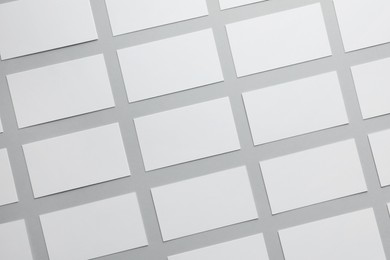 Photo of Blank business cards on light gray background, flat lay. Mockup for design