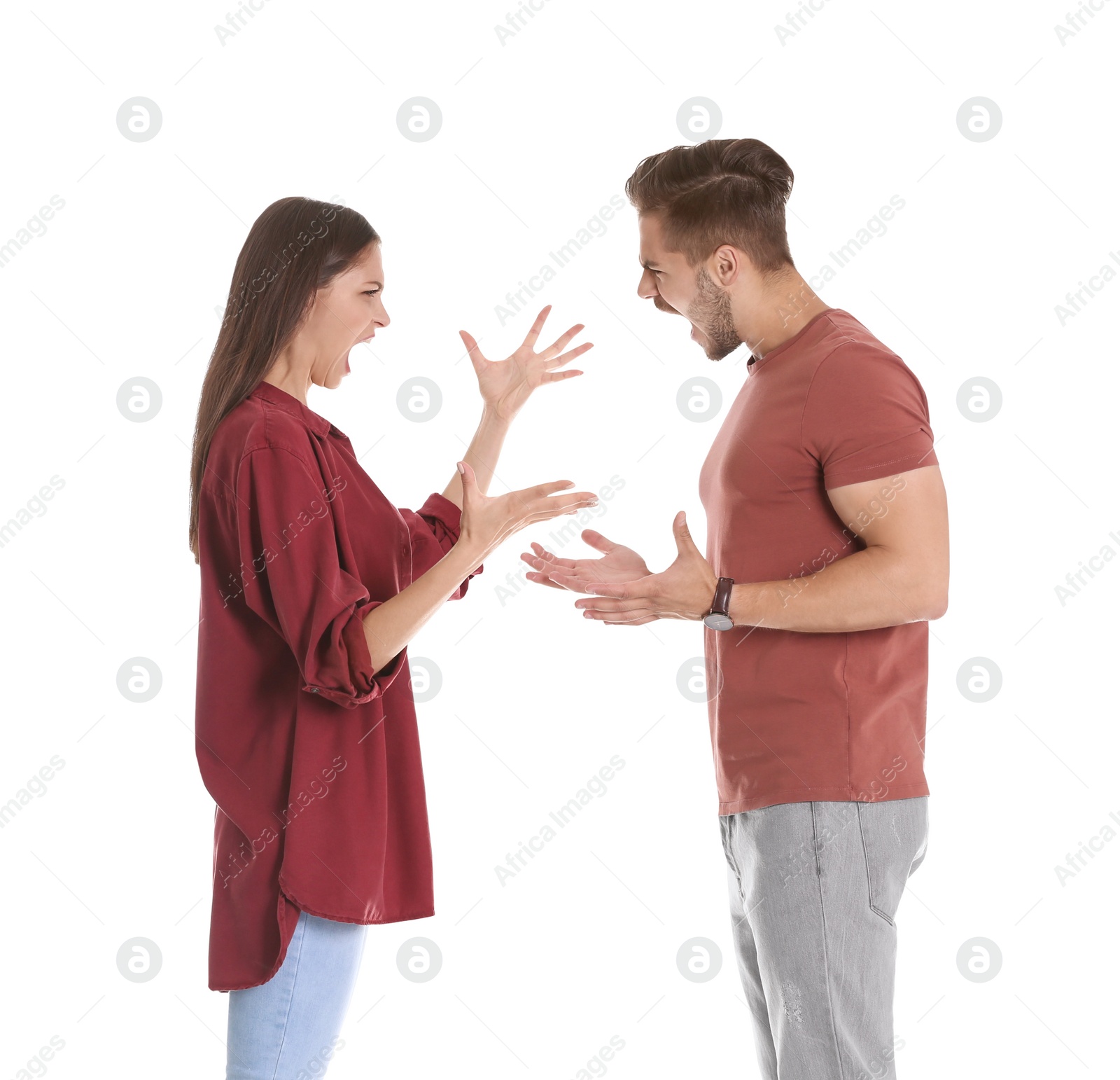 Photo of Young couple having argument on white background. Relationship problems