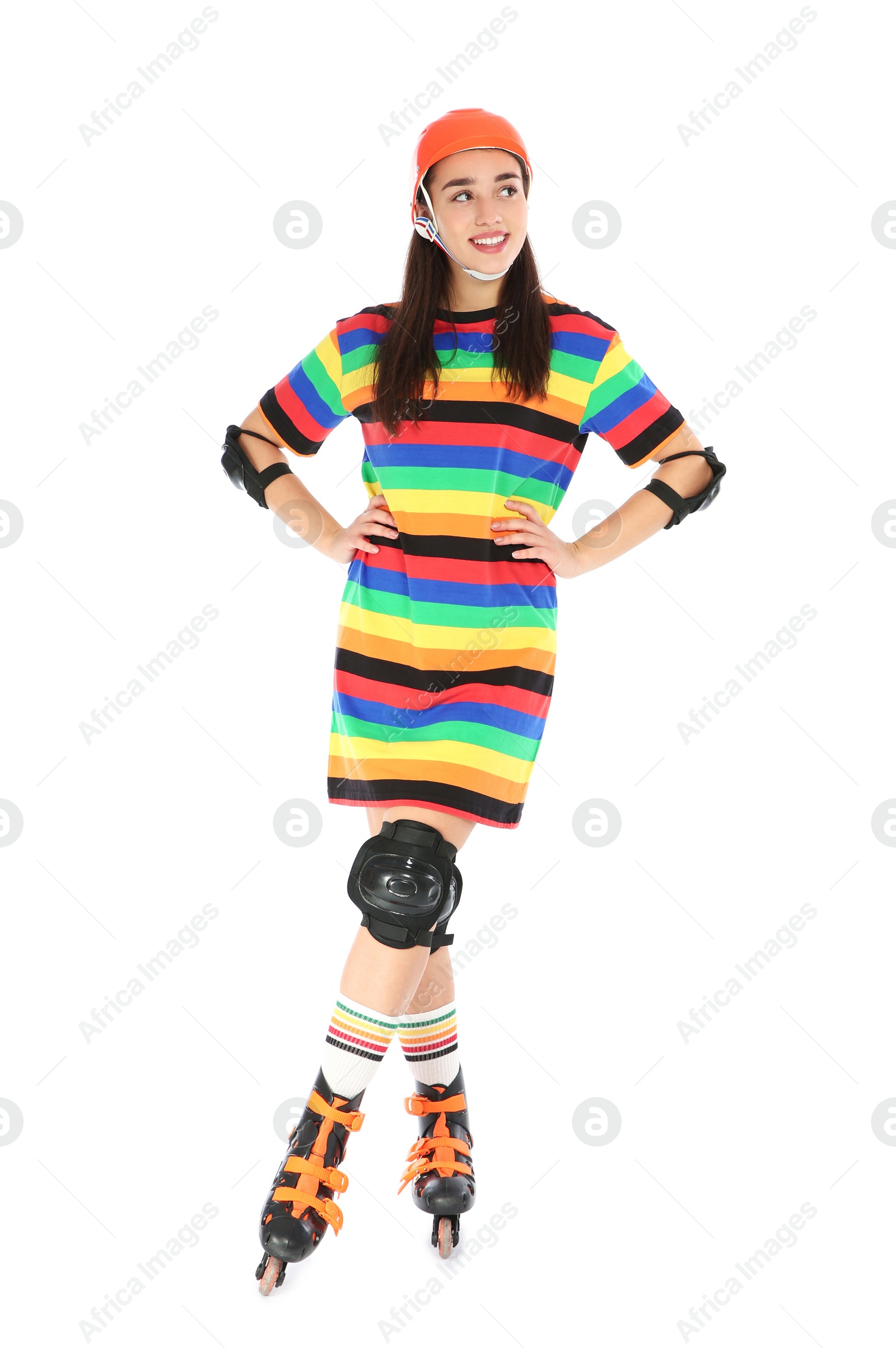 Photo of Full length portrait of young woman in bright dress with roller skates on white background