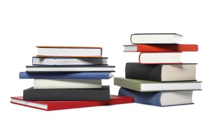 Photo of Many different hardcover books on white background