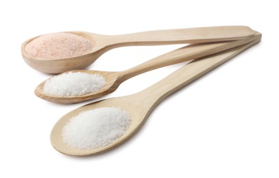 Different types of natural salt in wooden spoons isolated on white