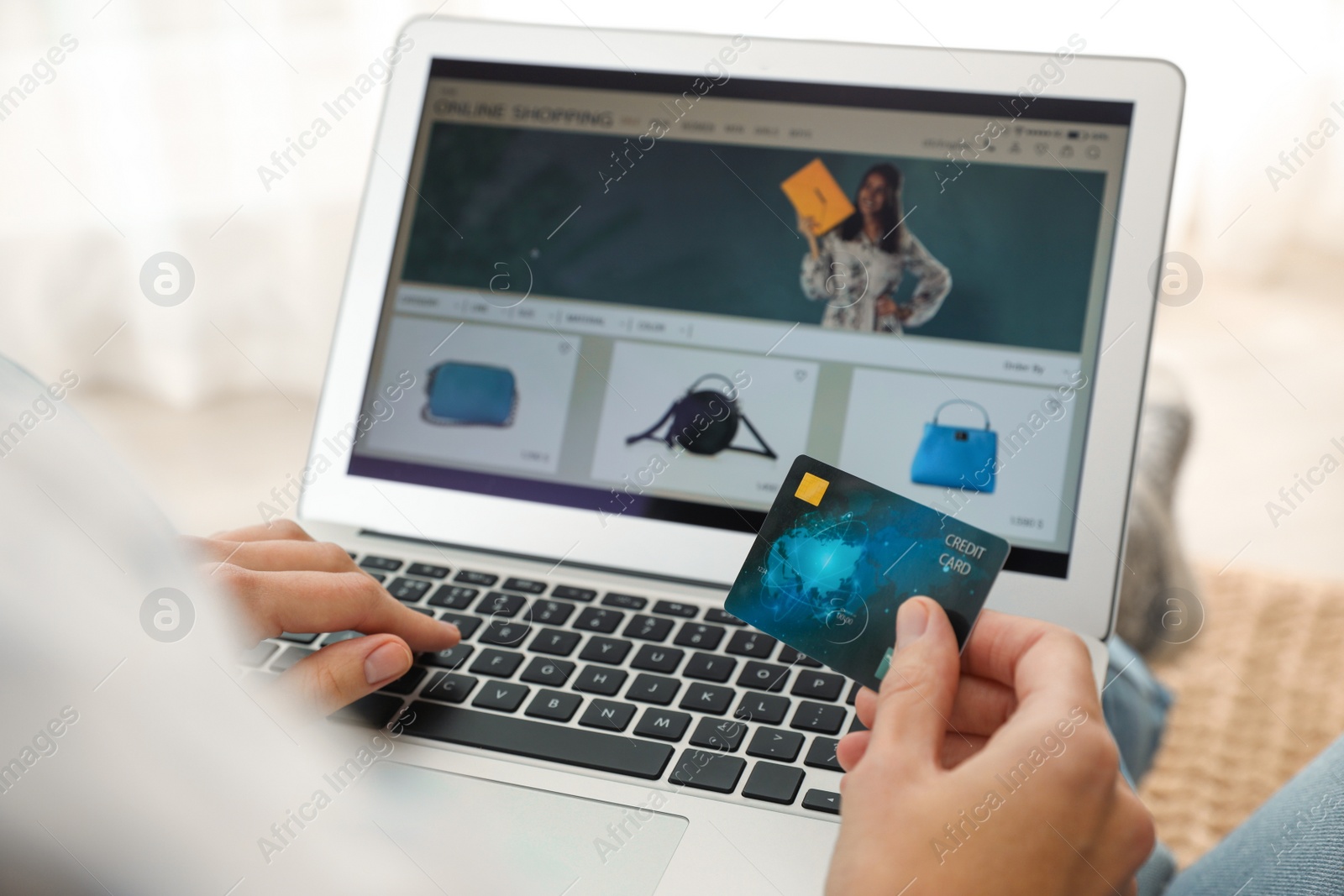 Photo of Woman with credit card using laptop for online shopping indoors, closeup