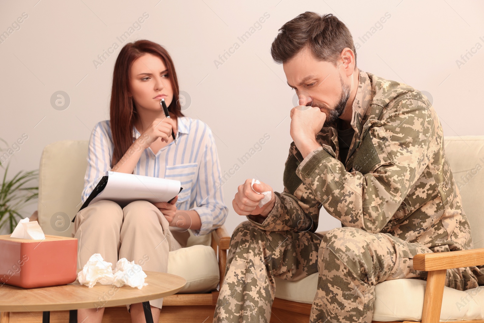 Photo of Psychologist working with military officer in office