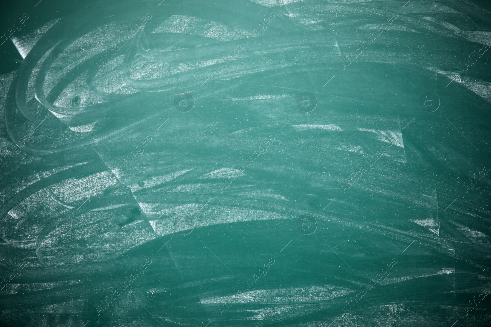 Photo of Dirty green chalkboard as background. Space for text