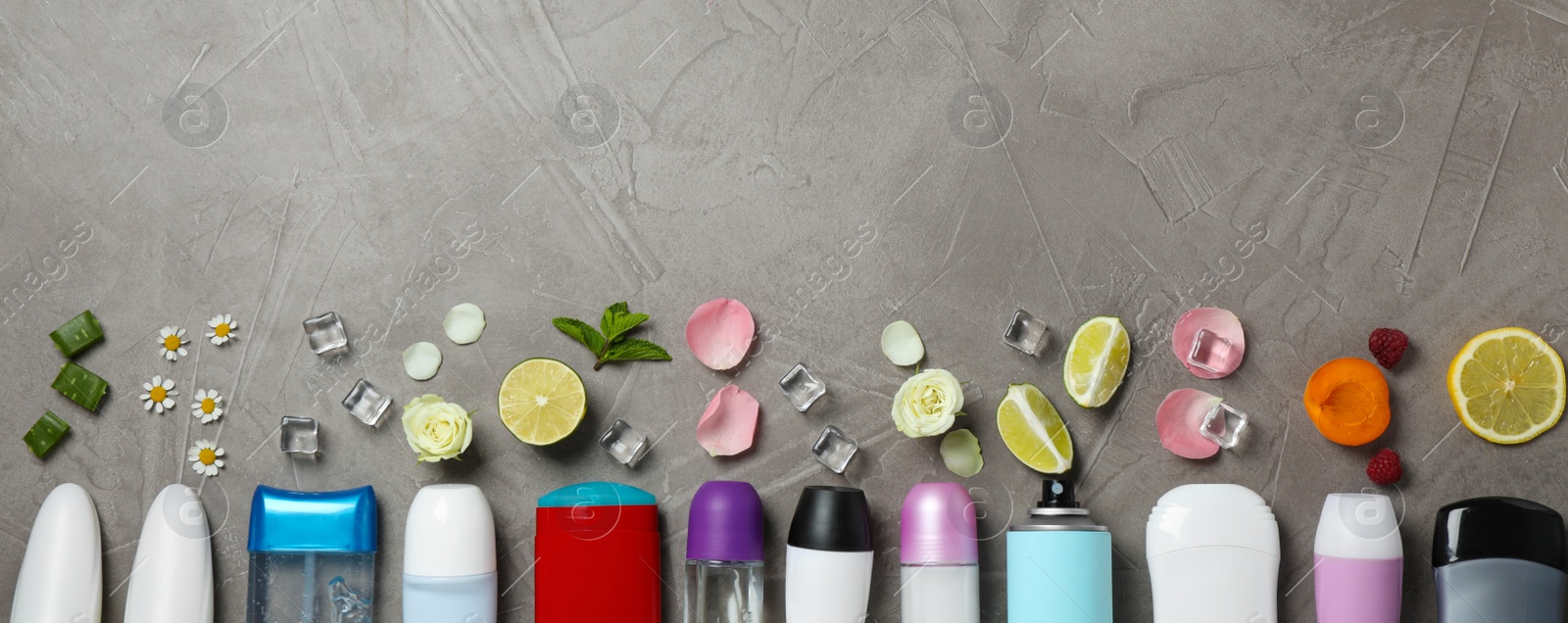 Photo of Flat lay composition with different natural deodorants and space for text on grey table