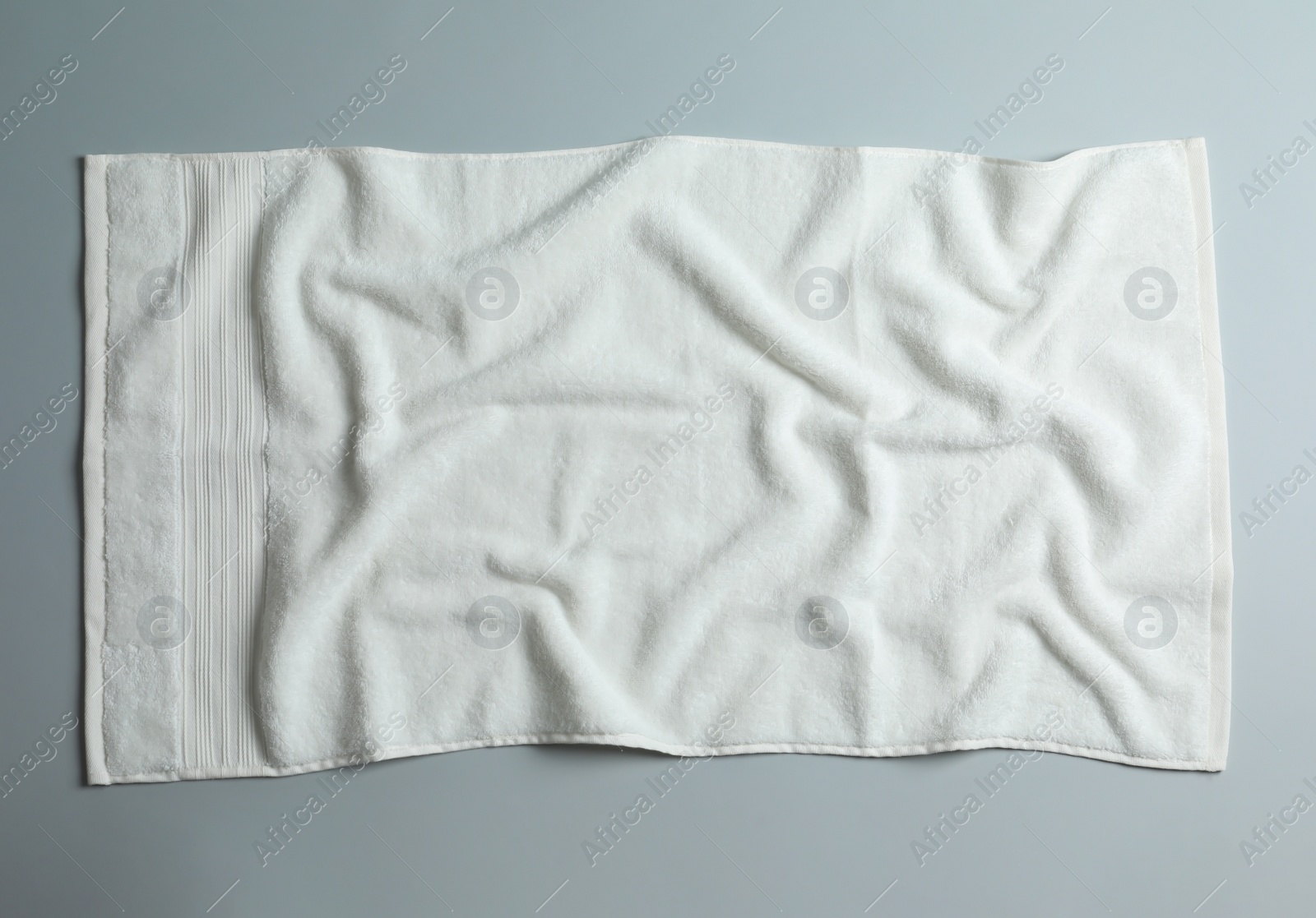 Photo of Soft towel on light background, top view