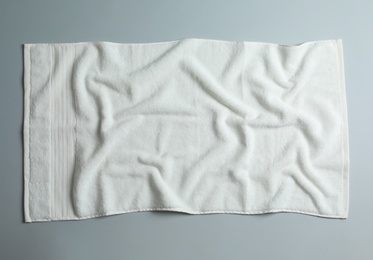 Soft towel on light background, top view