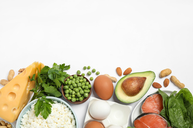 Photo of Different products rich in protein on white background, flat lay