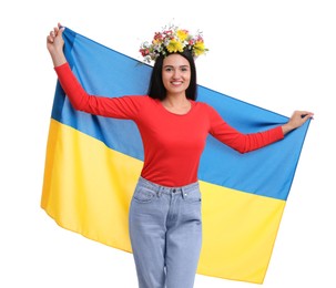 Young woman in flower wreath with flag of Ukraine on white background