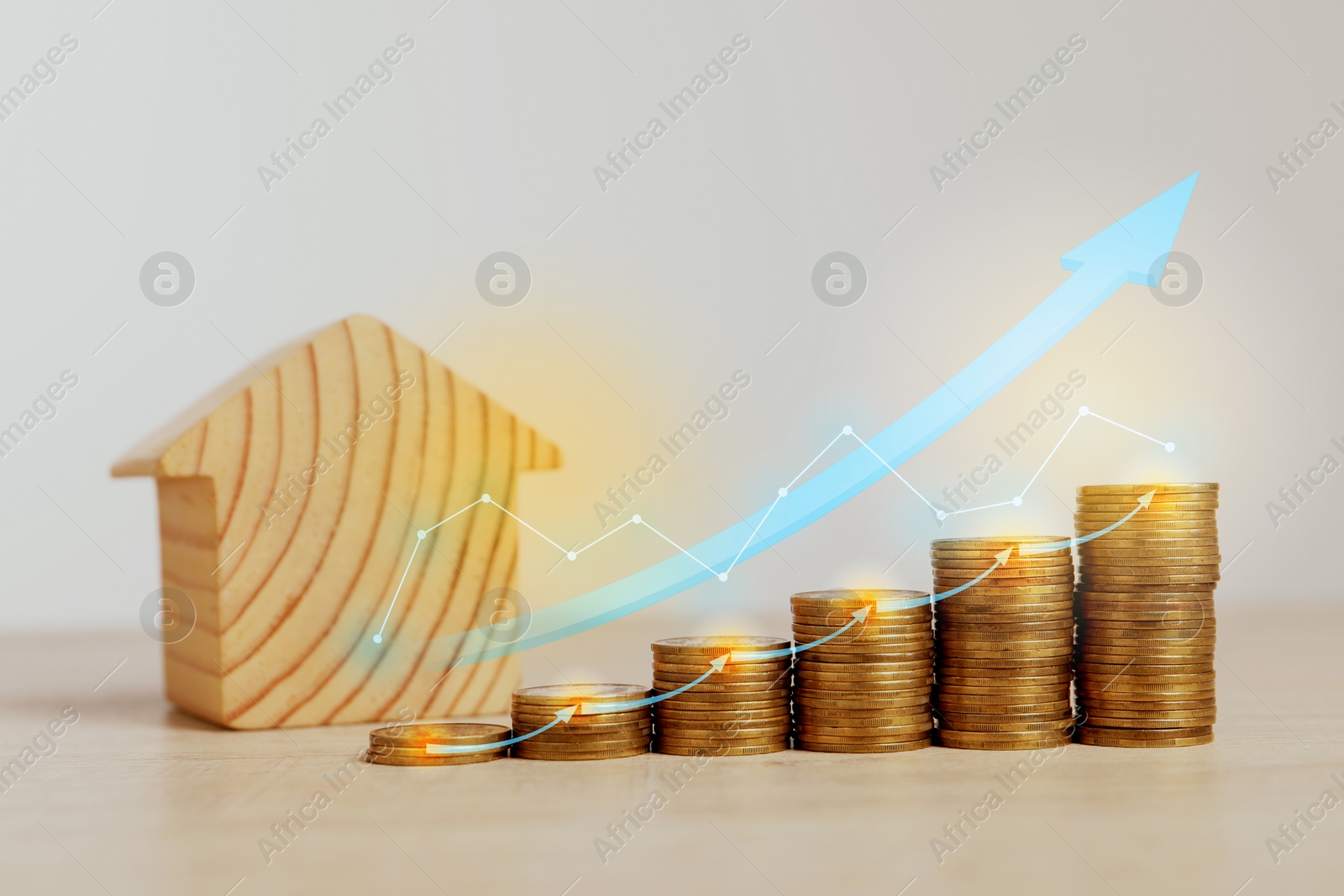 Image of Mortgage rate. Model of house, stacked coins, graph and arrows