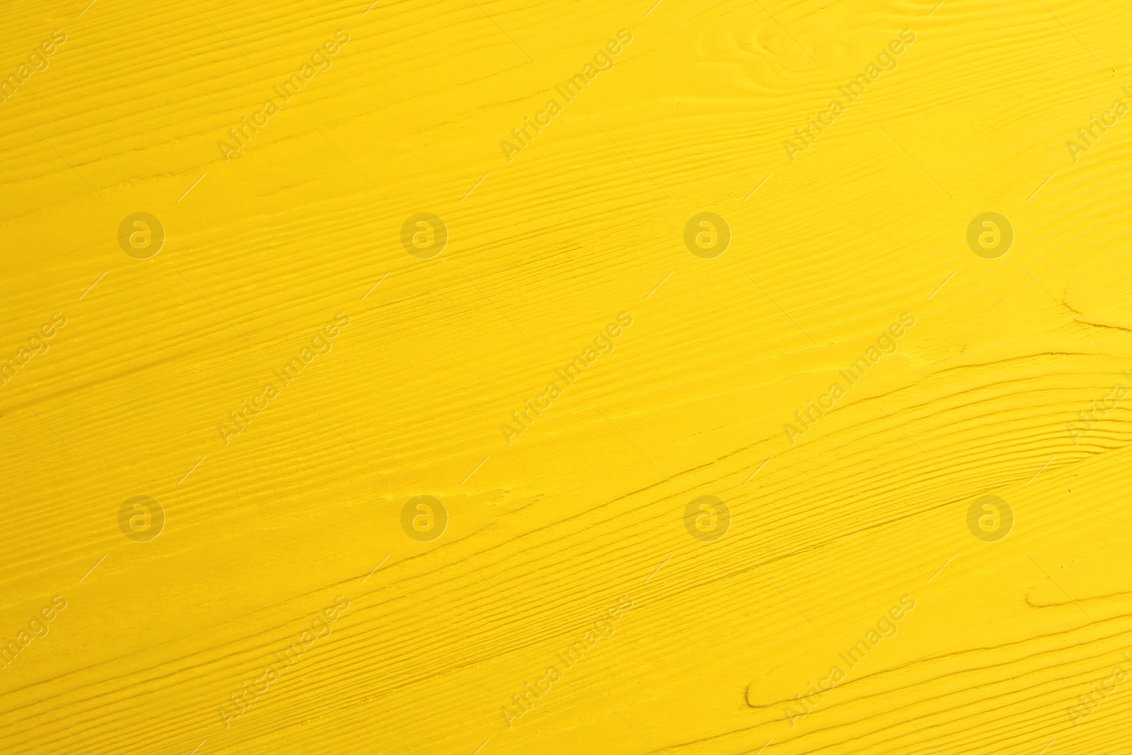 Photo of Texture of yellow wooden surface as background, closeup