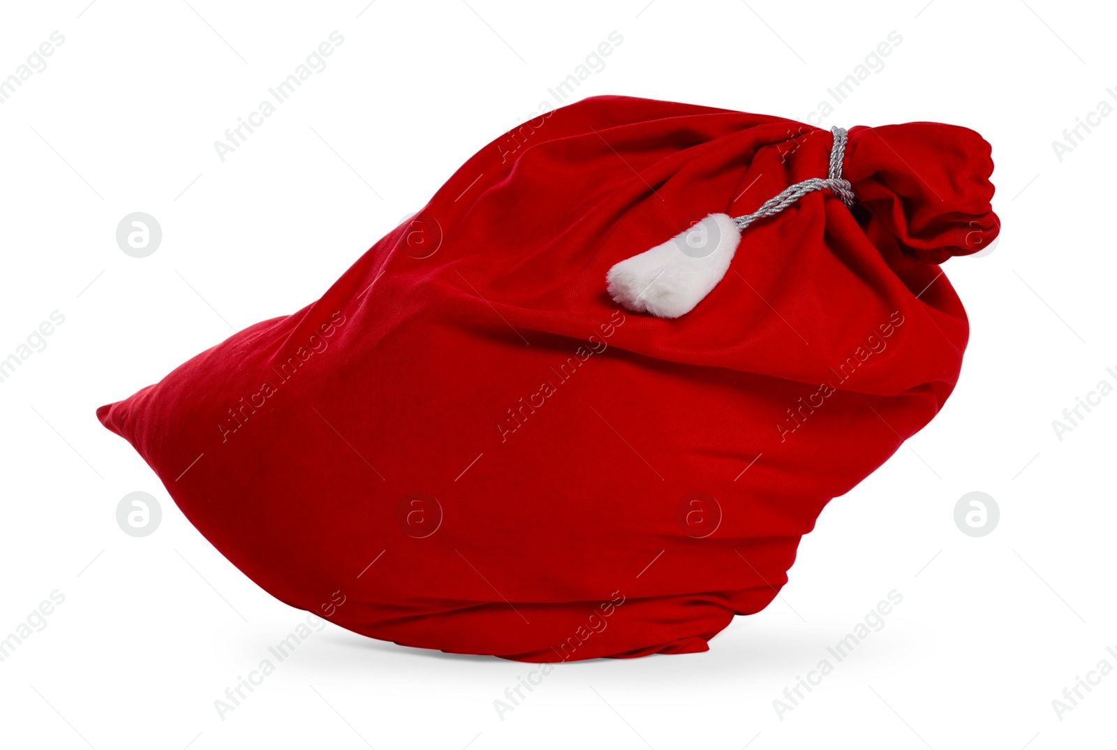 Photo of Santa Claus red bag full of presents isolated on white