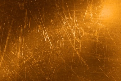 Image of Golden textured surface as background, closeup view