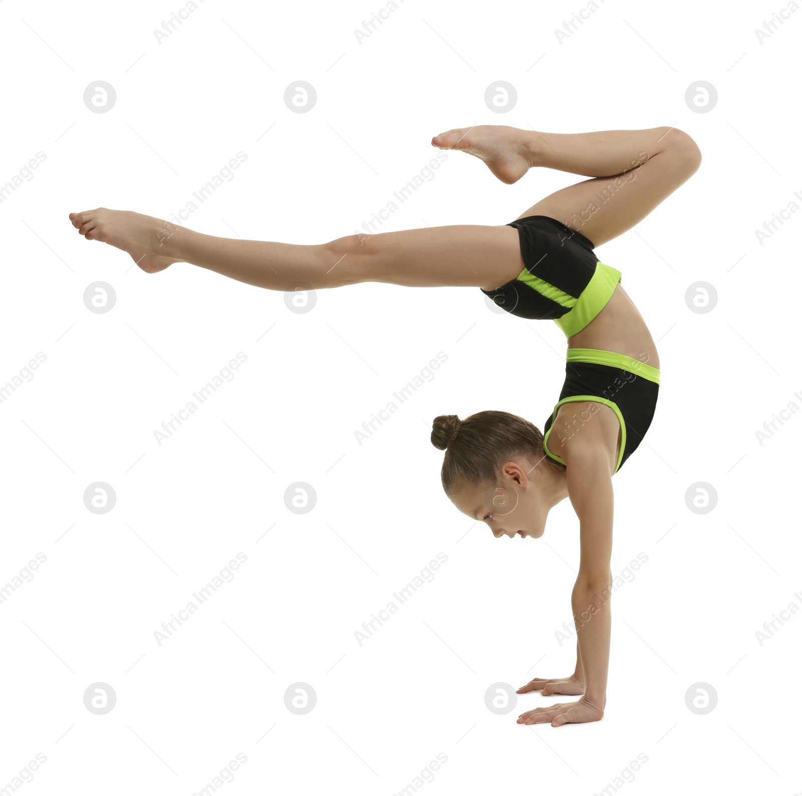 Photo of Cute little gymnast doing handstand on white background