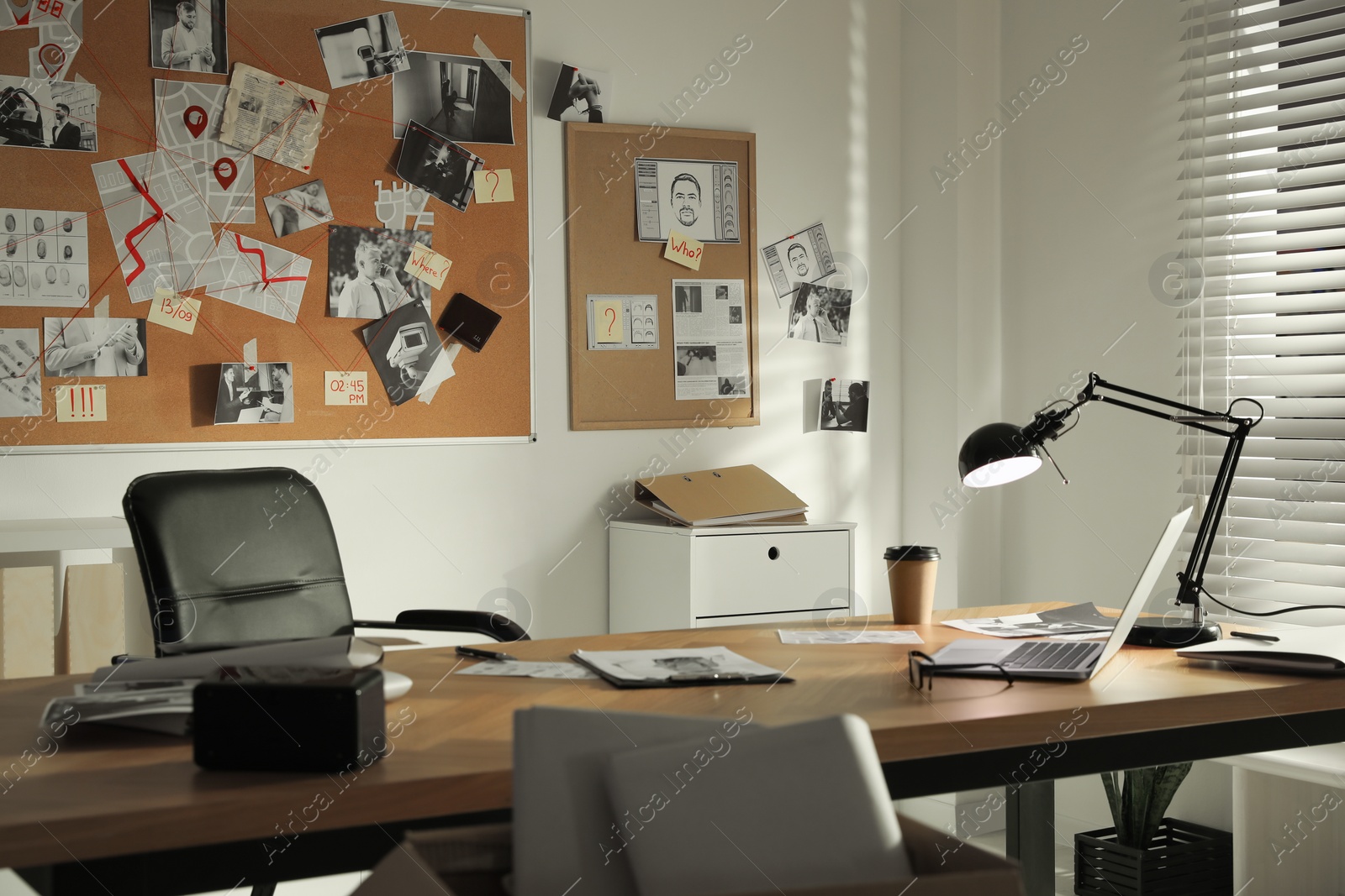 Photo of Detective office interior with big wooden desk and evidence board