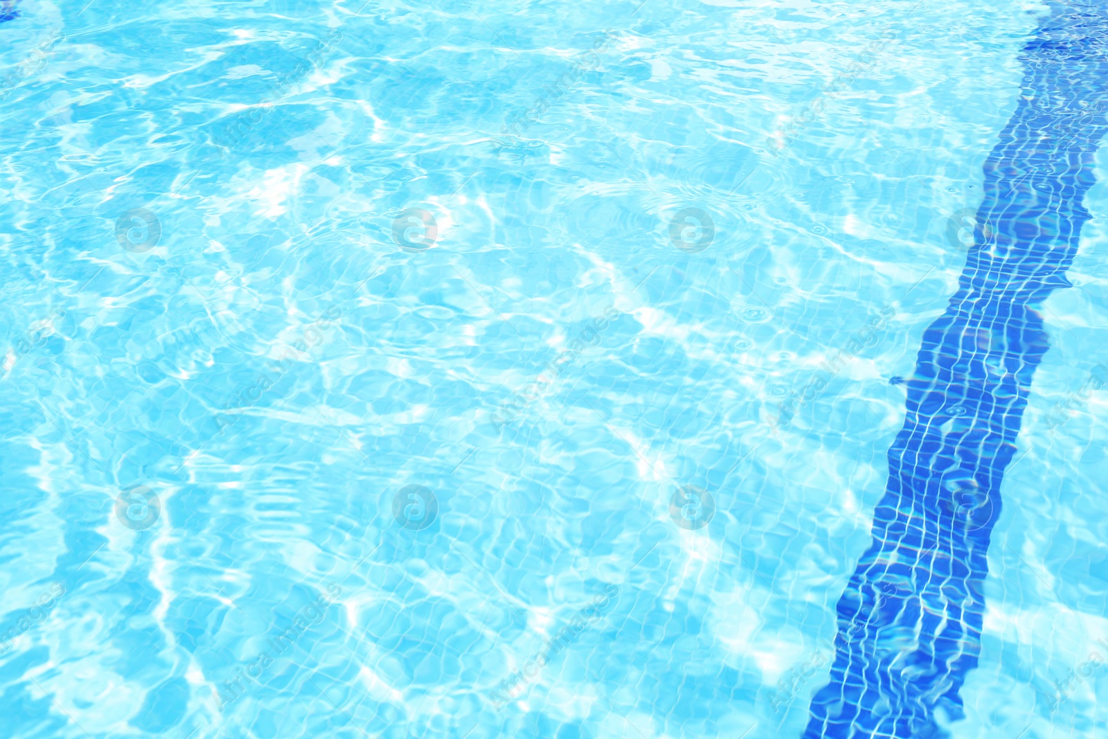 Photo of Outdoor swimming pool with clear rippled water